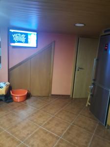 a room with a door and a tv on the wall at Casa da Gracita in Pereira +10 photos