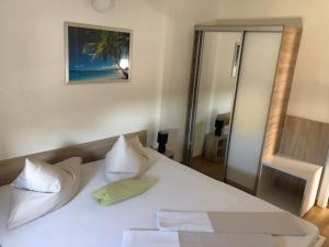 Postel nebo postele na pokoji v ubytování Appartements Antunovic