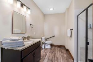 a bathroom with a sink and a toilet at Beautiful Branson Lodge Close to All the Action in Branson