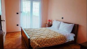 Postel nebo postele na pokoji v ubytování APARTMENT NELLY OPATIJA