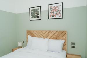 Ένα ή περισσότερα κρεβάτια σε δωμάτιο στο Brassbell l Zamalek l Jeddah Tower