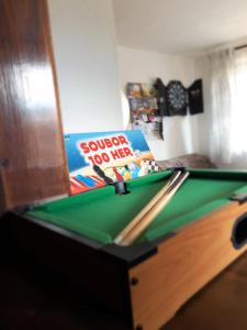 a book sitting on top of a pool table at Chalupa pri vodopade in Lúčky