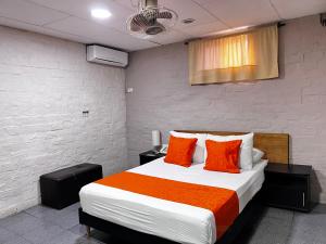 Ένα ή περισσότερα κρεβάτια σε δωμάτιο στο Hotel Casa Boston Inn by Finerh