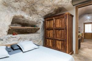 מיטה או מיטות בחדר ב-Masseria Ottavianello Doc Ostuni