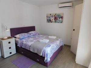 Кровать или кровати в номере Apartmani Grubelić - komforan novi apartman