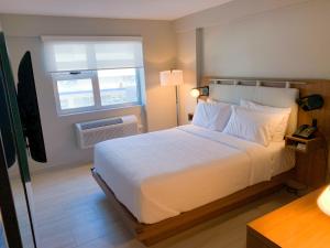 Voodi või voodid majutusasutuse TRYP by Wyndham Mayaguez toas