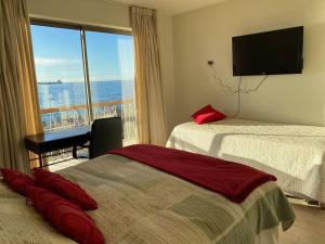 Кровать или кровати в номере Hermoso departamento frente al mar, Viña del Mar Reservar con más de un día de anticipación
