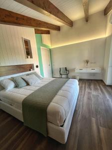 a bedroom with a large bed in a room at Bellavista Mansion in Agerola