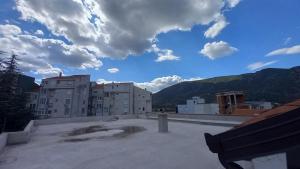 a view from the roof of a building with a bench at Apartments Platz in Mostar