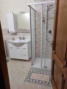 a bathroom with a shower and a sink at La Casa di Dedè in Sale