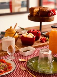 a table topped with plates of food on a table at Viva! Farmhouse in Monsaraz