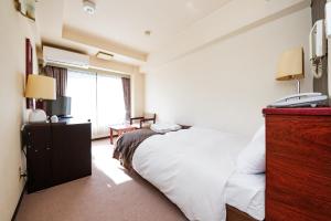 Postel nebo postele na pokoji v ubytování Sky Heart Hotel Koiwa