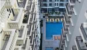 an overhead view of an apartment building with a swimming pool at Iloilo Staycation with a Pool, Gym and Playroom in Iloilo City