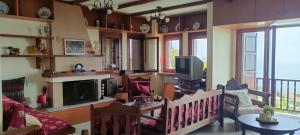 a living room with a couch and a table at Athina's Villa Uphill in Zagora