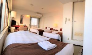 Postel nebo postele na pokoji v ubytování Sky Heart Hotel Koiwa