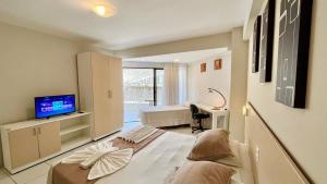 Μια τηλεόραση ή/και κέντρο ψυχαγωγίας στο Marsallis Flat 208 Praia - NBI - Ponta Negra