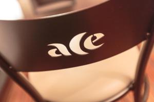 a chair with the ac logo on it at Ace Hotel Annecy in Annecy