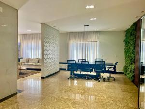 a conference room with a table and chairs at Hotel Veneza in Luis Eduardo Magalhaes