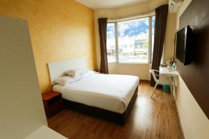 Ένα ή περισσότερα κρεβάτια σε δωμάτιο στο My Hotel Bukit Mertajam
