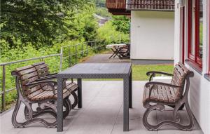 a table and two chairs sitting on a porch at Ferienhaus 39 In Kirchheim in Kirchheim