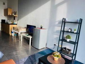 a living room with a refrigerator and a shelf at Miza Empire Damansara studio free wifi netflix in Petaling Jaya