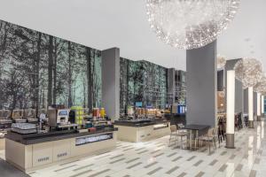 a rendering of a store with trees on the wall at Holiday Inn Express Kota Kinabalu City Centre, an IHG Hotel in Kota Kinabalu