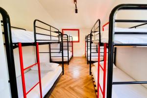 a room with a bunch of bunk beds at The Village Green Bunkhouse in Strath Creek
