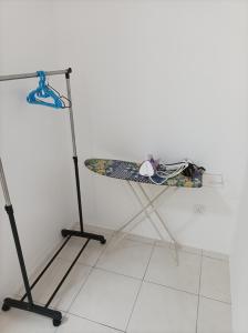 a table with a surfboard on top of it at Ike village in Kota Samarahan