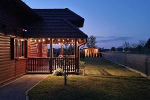 a house with a gazebo with lights on it at 54 Green Road Varaždin in Kućan Marof