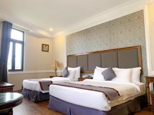 Postel nebo postele na pokoji v ubytování AVS Hotel Phu Quoc