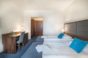 Łóżko lub łóżka w pokoju w obiekcie Apartamenty Rynek 20