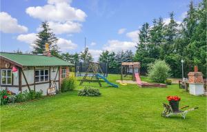 a yard with a playground and a slide at Cozy Home In Mscice With Kitchen in Mścice