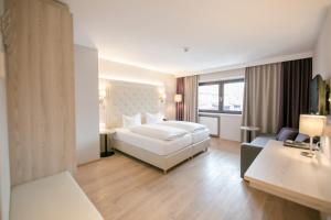 Posteľ alebo postele v izbe v ubytovaní Hotel Sailer