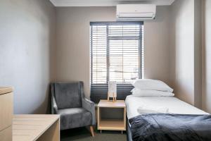Postel nebo postele na pokoji v ubytování Illinois Hotel