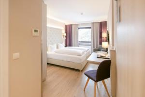 Posteľ alebo postele v izbe v ubytovaní Hotel Sailer