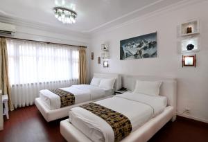 Rúm í herbergi á Hotel M Square Pvt.Ltd