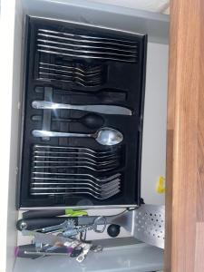 a box filled with cooking utensils in a oven at Daniel’s Semi Rural Retreat in Clowne