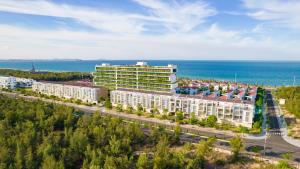 an aerial view of a building near the ocean at Khách sạn Minh Long in Tuy Hoa