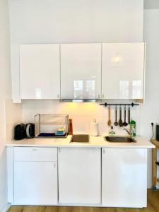 Kuchyň nebo kuchyňský kout v ubytování Cozy Apartment in Antwerpen Centraal