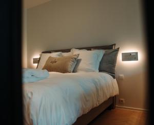 Postel nebo postele na pokoji v ubytování B&B De Tiendeschuur