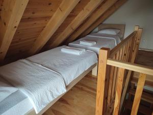 Letto o letti in una camera di Monte Pino Lux Apartments