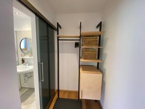 a bathroom with a shower and a sink at Waldruh in Wiesing