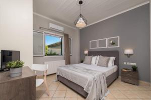 a bedroom with a large bed and a window at Madini Luxury villa with private heated pool in Vanáton +43 photos