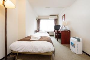 Postel nebo postele na pokoji v ubytování Sky Heart Hotel Koiwa