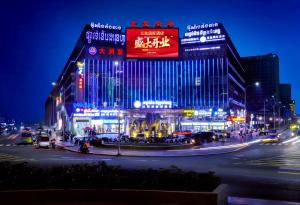 a building with a sign on it at night at Five Elephants Hotel in Sihanoukville