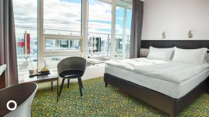Postel nebo postele na pokoji v ubytování Center Hotels Plaza