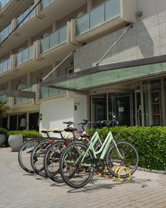 a row of bikes parked in front of a building at Golden Star City Resort in Perea