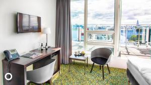 TV a/nebo společenská místnost v ubytování Center Hotels Plaza