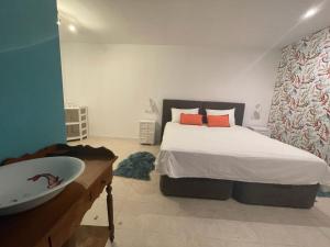 A bed or beds in a room at Ca Olivar
