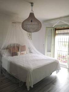 A bed or beds in a room at Ca Olivar
